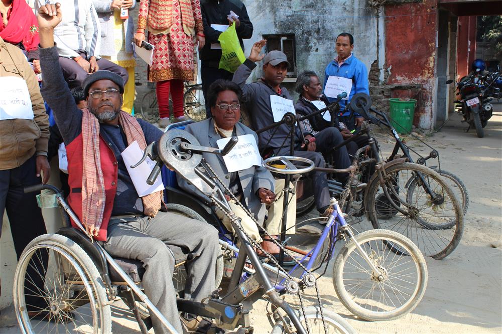 People with physical disabilities participating in a demonstration. 