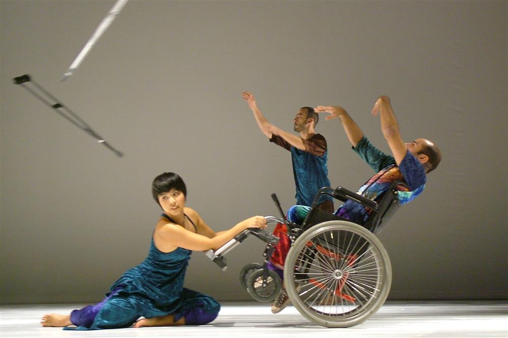 Dance performance with crutches in the air