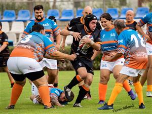 Rugby players of diverse body types and genders engage in an intense yet friendly match. The image celebrates teamwork, resilience, and equality in sport, showing how inclusion strengthens both competition and community.