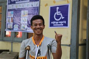 A person with a physical disability who casted his vote in Burma.