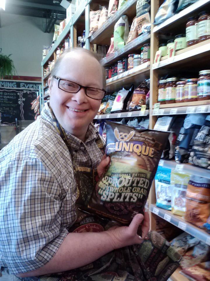 Bill enjoys his work as a stocker at Sweet Clover Market © Michelle Paya