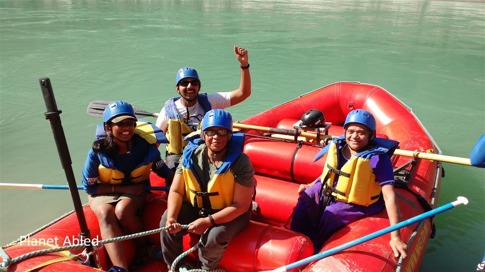 People with different disabilities on a rafting trip. 