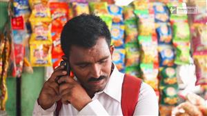 A man accessing information through a mobile phone.