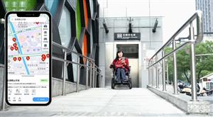 An Asian woman using a powered wheelchair exits an accessible elevator along a ramp. Beside her, a smartphone screen displays a map with accessibility features. The image celebrates urban design and technology that support mobility and equal access.