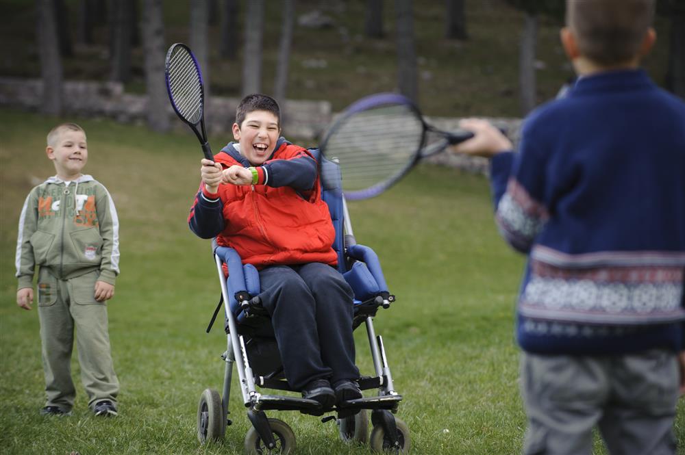 Young people with and without disabilities playing together.