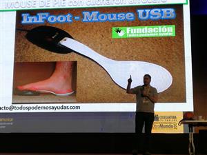 A man presents an assistive technology project called “InFoot – Mouse USB,” demonstrating a computer mouse operated by foot movement. This inventive idea, developed for people with limited hand mobility, promotes digital inclusion and accessibility in everyday computing.