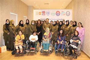 A group of Pakistani police officers and women with disabilities gather for an awareness session on rights and inclusion. Their unity, professionalism, and strength highlight equality and mutual respect, fostering justice and accessibility in public service.
